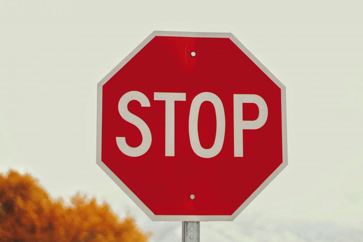 A stop sign indicating the importance of an Integrated Sanctions Checker